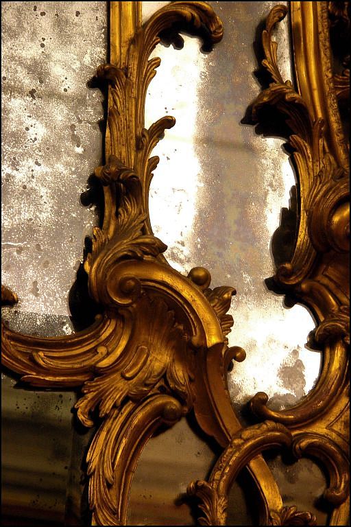 details of a vintage gold mirror frame